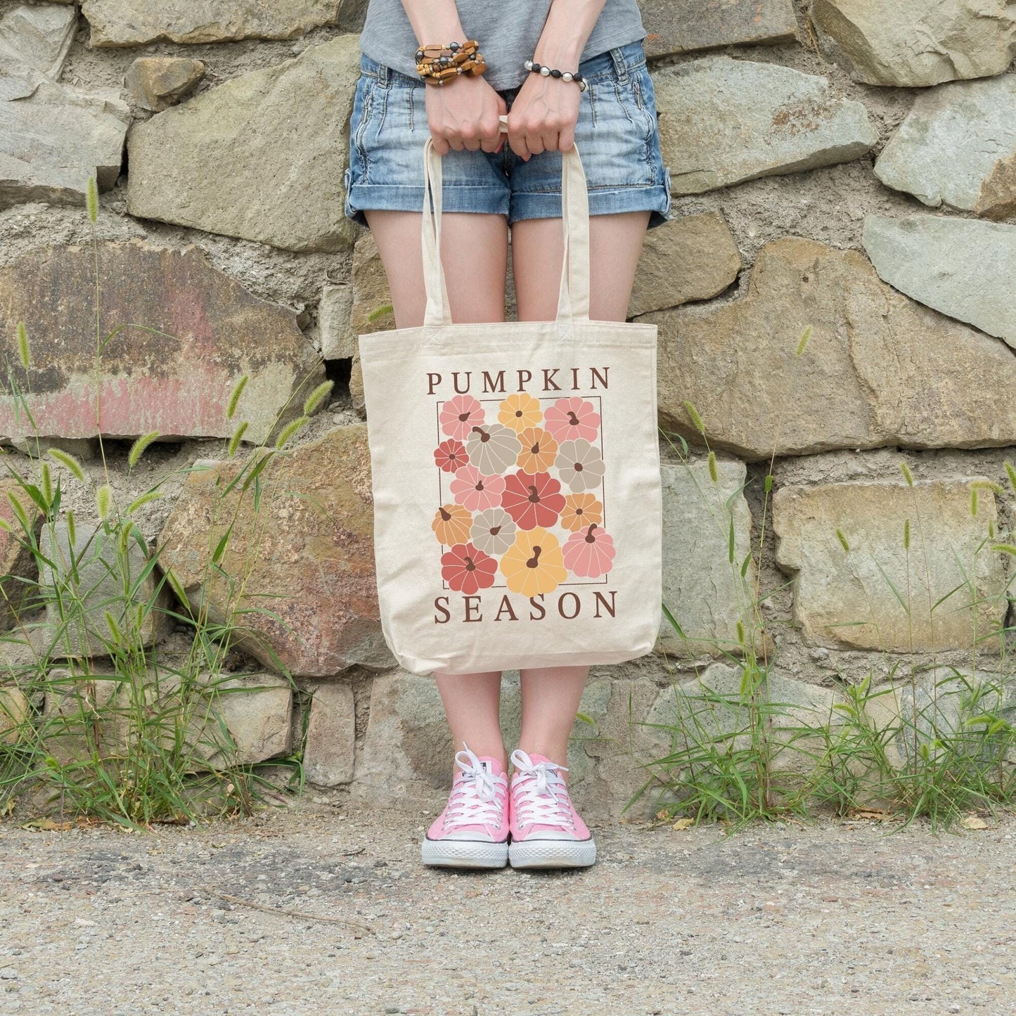 Canvas Tote Bag 15 inches by 15 inches printed with pumpkins in boho colors and the phrase "pumpkin season"