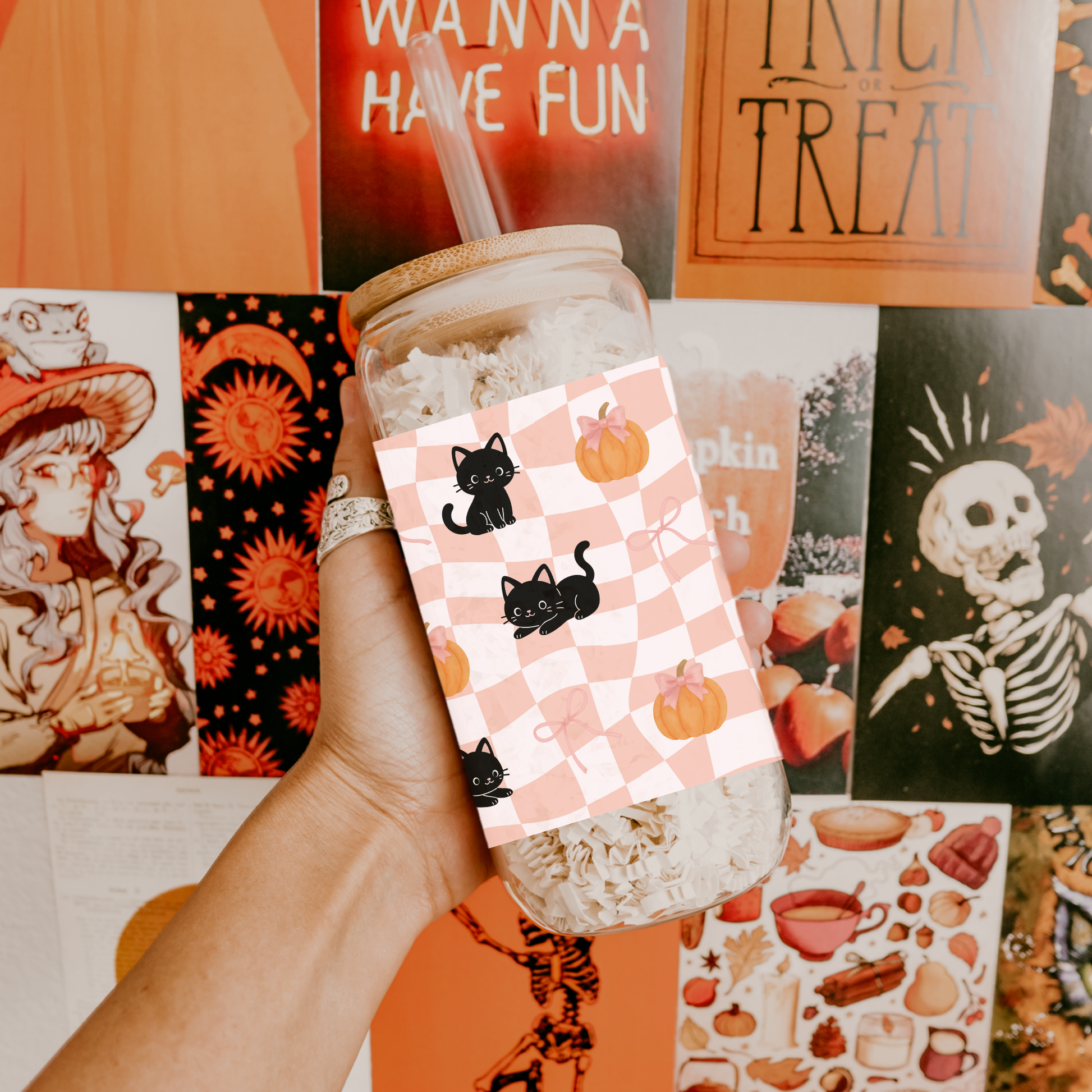 a jar with a Halloween-themed card featuring cats and pumpkins