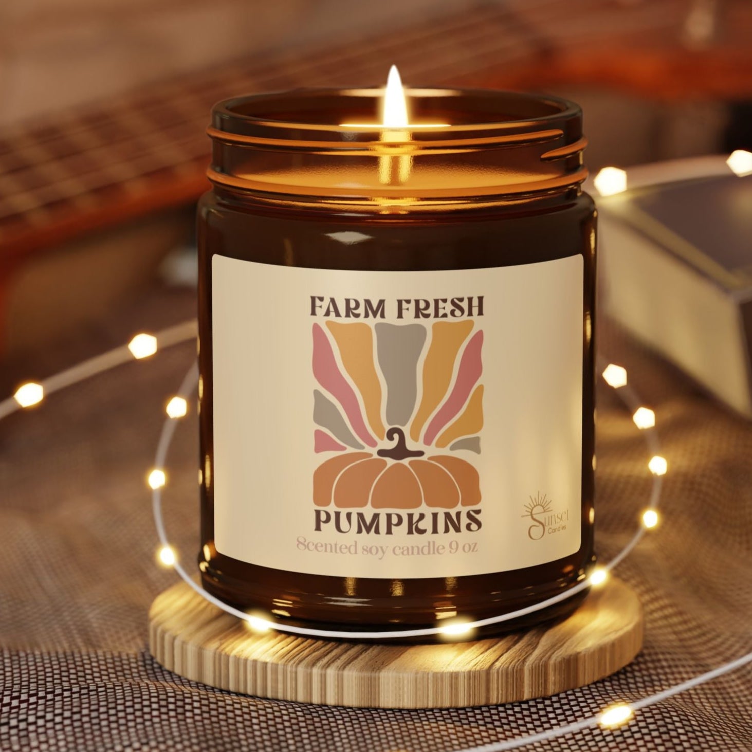 A scented candle with 'Farm Fresh Pumpkins' label is the perfect cozy gift for fall season