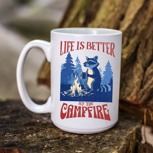 ceramic coffee mug with a vintage raccoon design of a campfire and a phrase "life is better by the campfire" perfect gift for camping enthusiast