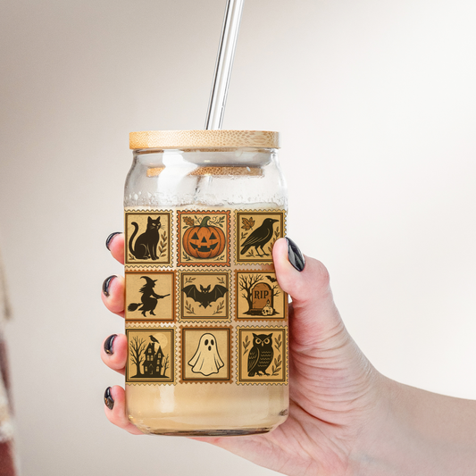 glass jar with Halloween-themed labels against a neutral background iced coffee mug perfect gift for halloween and thanksgiving